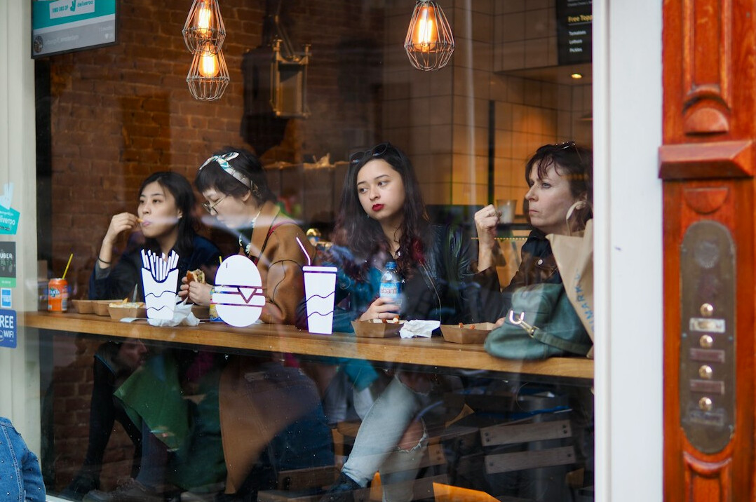 Friends listening to each other in a cafe