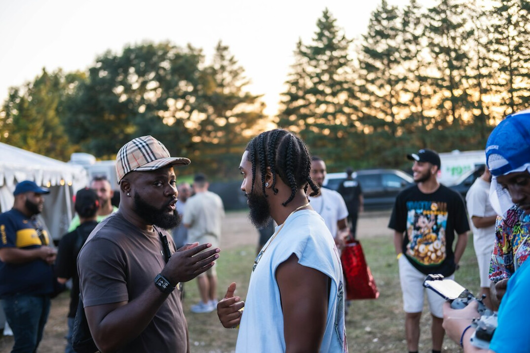 People talking in a circle at an event