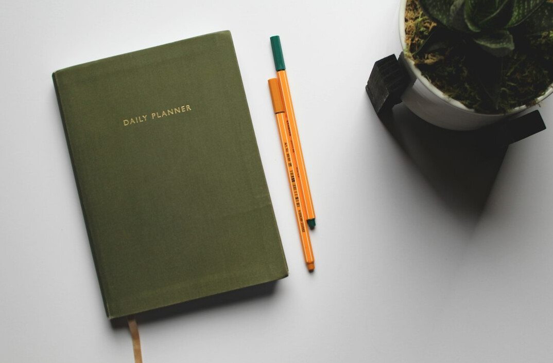 Open notebook with handwritten goals on a desk